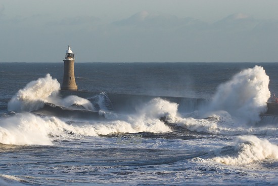 Waves breaking over Tynemouth Lighthouse, River Tyne North Pier.