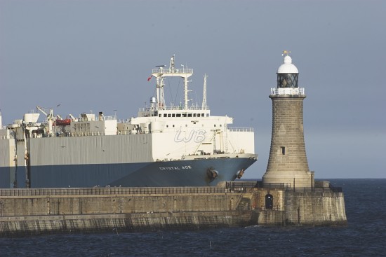 Giant Cargo Ship passing Tynemouth Lighthouse, River Tyne North Pier.